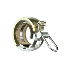 Knog Oi Luxe kerékpáros csengő sárgaréz színben